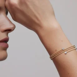 Pulseira espiral em ouro com dois diamantes TOUS ATELIER